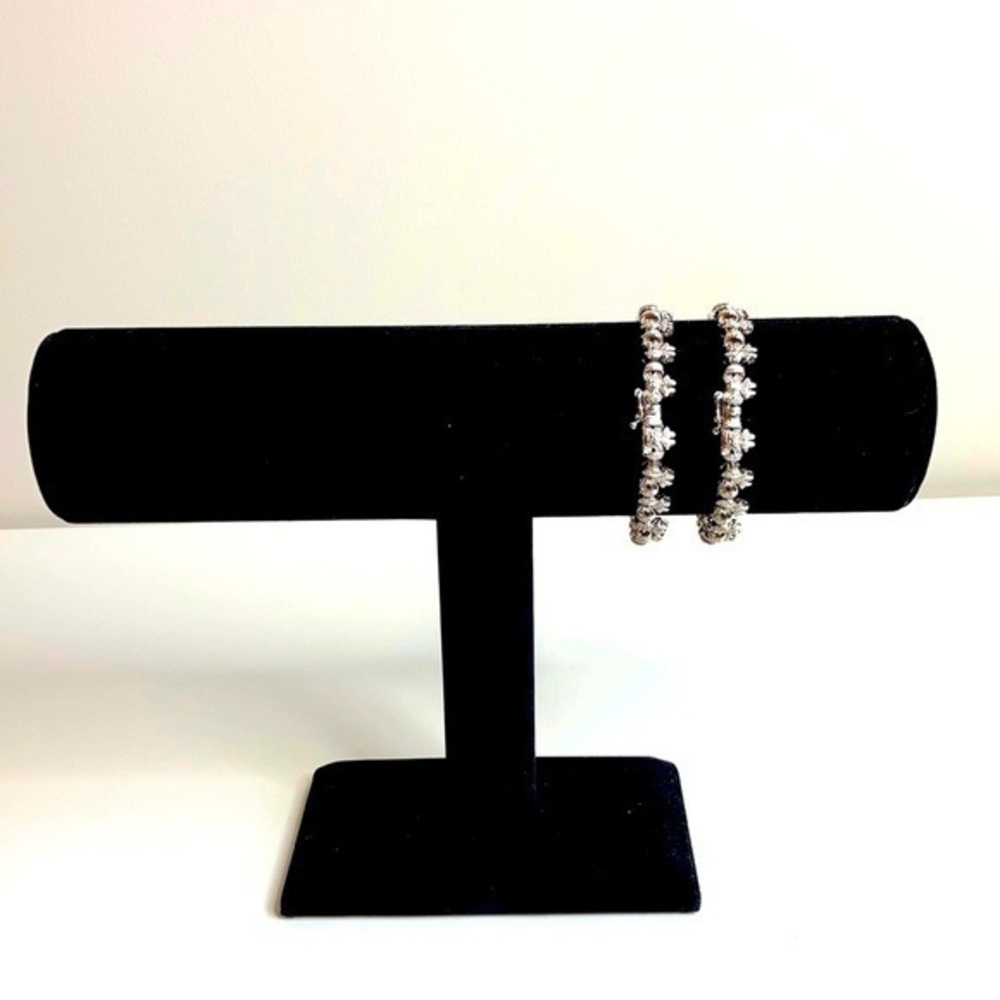 Sterling Silver String Of Bows Set Of 2 - image 1